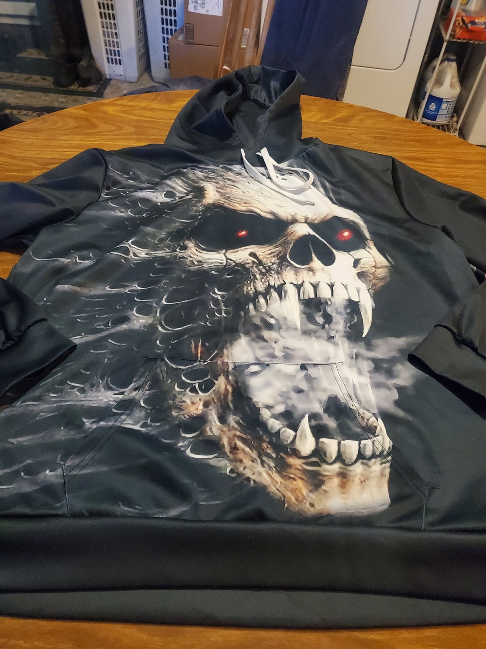 Source Unknown Black Hoodie with Red-Eyed Skull Graphic